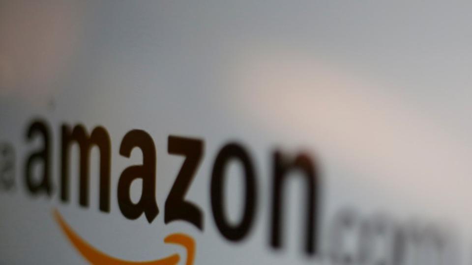 FILE PHOTO: The logo of the web service Amazon is pictured in this June 8, 2017 illustration photo. REUTERS/Carlos Jasso/Illustration/File Photo